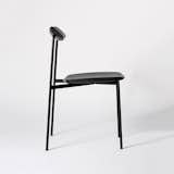 Sia Chair is a minimal chair created by Sydney-based designer Tom Fereday. The SIA chair, meaning movement was named after its unique adjustable backrest. Inspired by traditional bearings the SIA chair is slender in design yet uncompromising in comfort. Shaped from solid Ash the SIA chair curves to the bodies form whilst using the minimum amount of timber required to achieve comfort. The chair is contrasted by a minimal stainless-steel frame which supports the sculptural timber elements and allows for a stackable design. Solid bronze self-lubricating sleeve bearings elegantly assemble to the chair frame allowing for smooth angle adjustment of the chair and structural support for the backrest. Using the natural flex of the steel frame the backrest is simply press fit assembled allowing for minimal shipping volume and easy end of life recycling or repair. The SIA chair was the winner of the Mercedes-Benz design award and will be launched with NAU Design in March 2018.