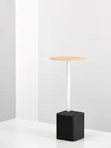 Sushi Lamp is a minimal lamp created by Berlin-based Hayo Gebauer. Sushi Lamp is a table companion that emits light and serves as a container. The light source is made of a satin finished LED tube that distributes light evenly. The extruded base of the lamp accommodates small objects like chopsticks, napkins or pens. Its look is based on the shape of Hoso Maki, a type of sushi. It functions in restaurant and office environments.