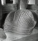 Finished Bertoia Diamond Chair frames stacked and awaiting assembly. Image from the Knoll Archive.
