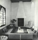 The main part of the 48-foot-long living room of York Castle, where Florence Knoll chairs were arranged around the fireplace.&nbsp;