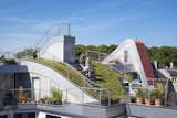 In Copenhagen’s Nørrebro neighborhood, architect&nbsp;Julien De Smedt replaced an apartment building's confined attic area with three new penthouses and built a common "backyard" on the roof. The construction was done to make sure that the four areas of the roof—the sundeck, grass hill, play space, and outdoor terrace—all felt like distinct but united areas.