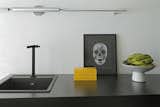 Kitchen and Drop In Sink Inovart Woodworking helped create the metal sheet shelf in the common area.  Search “bathsinks--drop-in” from A Brazilian Bachelor Pad Embraces Light and Darkness