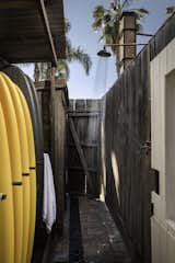 Outdoor, Side Yard, Wood, Shower, and Walkways  "I want the members to feel completely comfortable and not want to leave," she says. "The property still maintains a beach-house charm."

  Outdoor Shower Wood Side Yard Photos from A 1940s Beach Home Is Restored Into a Gorgeous Clubhouse in L.A.