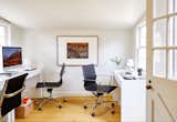 The traditional office is located toward the back of the house, in the "bedroom," but maintains a minimalist feel.&nbsp;