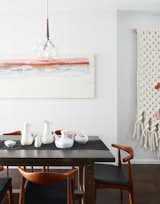 Dining Room, Table, Chair, Pendant Lighting, and Dark Hardwood Floor Be sure to look at multiple neighborhoods, and be willing to rework your "must haves" in order to move into a new home.   Photos from Here’s Everything You Need to Know About Buying a Home, According to Three Experts