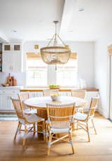 Owens sourced the dining table from Restoration Hardware, and picked up the bistro chairs from Wayfair. The beaded Ro Sham Beaux chandelier has custom-made beading. 