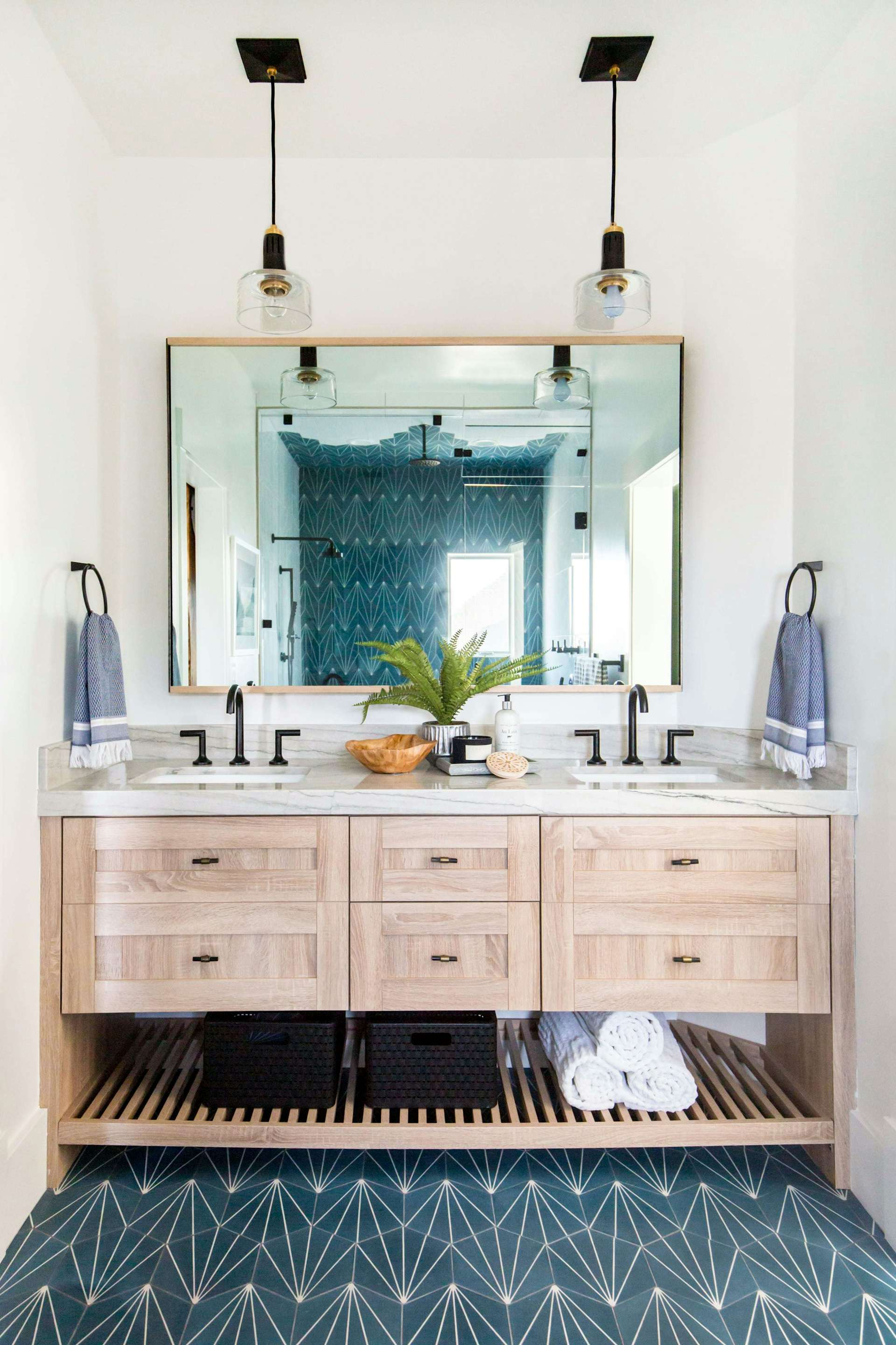 West says that you should choose a bold, colorful tile for the floor, and then run it up the side of a wall as an eye-catching accent. That's what she did in this kids' bathroom. 