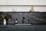 "The owners wanted to stay away from marble for durability reasons and didn’t like the look of a lot of traditional granites," Nye says. "This stone is a granite but has the veining of marble and a very striking appearance."&nbsp;