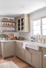 “We went with marble counters, using leftover materials to create a marble sink in one of the bathrooms on the main floor,” she says.