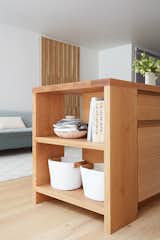 The open shelves of the kitchen are a place to showcase the couple's cookbooks and ceramics, which Amy also creates. 