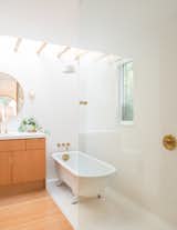 Carriage House by Medium Plenty glass-partitioned bathroom with open shower
