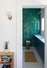 A bathroom inside a Florida property first built in the 1920s receives a renovation featuring mermaid-green subway tile.&nbsp;