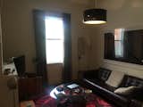 Before: The original living area was blocked off from the kitchen, which made it feel smaller and darker.   Photo 5 of 11 in Before & After: A Terrace House in Melbourne Takes an Unexpected Turn