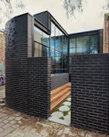 Turn House by Rebecca Naughtin Architect courtyard with black brick wall