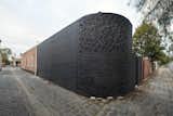 Turn House by Rebecca Naughtin Architect black brick wall boundary