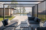 The pergola overlooks the pool with the Baltic Sea in the distance. The couple built the home so that there would be as much outdoor space as indoor space.
