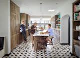 The kitchen design embraced the home's Spanish architecture with decorative floor tiles and richly-hued wood tones.  Photo 3 of 9 in Maryland Street by Asquared Studios
