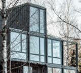 Exterior, Shipping Container Building Type, House Building Type, Metal Siding Material, Metal Roof Material, and Flat RoofLine "The house blends in with the rocks, but also stands out in a beautiful way,  Photo 2 of 7 in A Shipping Container Home Rises on a Rocky Site Outside Stockholm