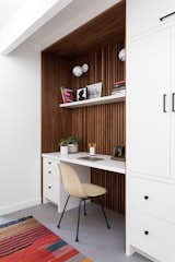 "The office built-in was also designed with classic mid century clean lines and asymmetry in mind—it's half workspace, half storage,