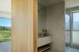 The bathroom was kept simple with an all-over concrete finish.