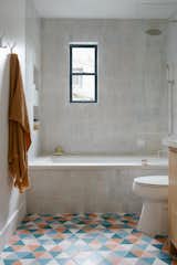 Bath Room, Drop In Tub, Ceramic Tile Floor, Soaking Tub, Open Shower, and One Piece Toilet Popham Design supplied the tiles in the bathrooms, were Gebhardt chose to incorporate more color.  Photo 13 of 50 in The 50 Most Saved Photos of 2023 by Dwell from A Surprising Venice Beach A-Frame Reaches Its Peak Potential