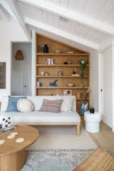 An armless sofa from Anthropologie creates an extra living space in the upstairs loft.