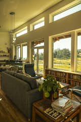 The prefabs have a long, spacious living space that gets plenty of natural light from a wall of windows.  Photo 4 of 8 in Two Friends Started This Prefab Company to Beat the Weather and Build Homes Year Round
