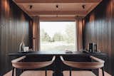 In this model, the workspace perfectly overlooks the view.  Photo 11 of 11 in These Tiny Prefab Cabins Are Designed to Feel Like Luxe Hotel Rooms