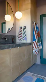 The full bathroom has a vanity outfitted with storage.  Photo 9 of 15 in Budget Breakdown: She Turned a Joshua Tree Shack Into a Homestead for the Long Haul With $456K