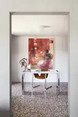 In the office, the same terrazzo floor tiles create continuity.