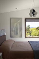 A guest room overlooks the vineyard.
