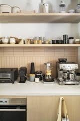 While much of the home is outfitted with concealed storage, the owners wanted this area of their kitchen to feel airy and open.