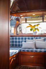 At the back of the Airstream, a U-shaped lounging area converts into a queen-sized bed for adults.