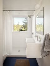 Bath Room, Full Shower, Open Shower, and Drop In Sink A walk-in shower makes it possible for this ADU to eventually serve as a home to age in place.  Photo 7 of 9 in Want to Design Your Own ADU? This Prefab Company Gives You the Tools