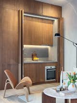 The kitchenette, which has a cooktop and oven, can also be concealed when not in use.