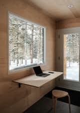 The desk can be lowered to create more space to move around the bunkie throughout the day.