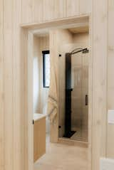 The bathroom features a walk-in shower heated by an electric hot water tank.&nbsp;