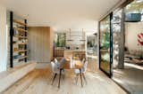 The kitchen seamlessly connects the dining area to the living room.