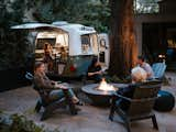 A small backyard camper makes for a fun hideaway when friends and family come to visit.