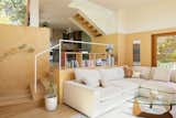 A small staircase separates the kitchen from the living space. "When you have two young kids, they never leave your side. Suddenly a 1,200-square-foot home feels even smaller,