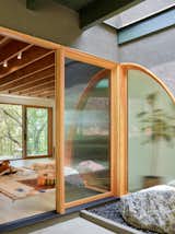 Wang repositioned the entryway to create more space for the living room. It's highlighted by a skylight and planter box.