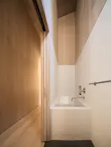 As part of the angles of the structures, there are tight quarters—like this one in the kids' bathroom. A separate water closet keeps the room from feeling too tight.