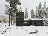 One structure contains the garage, a mezzanine, and the entryway. All four structures are connected, even though they look distinct.