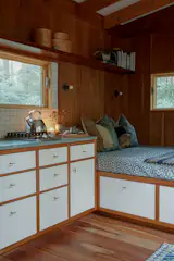 Storage keeps the 180-square-foot space tidy, and the couple were inspired to embrace a minimalist and natural aesthetic after a recent trip to Japan.