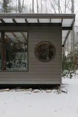 One of the challenges Joey faced was constructing this round window, which they wanted to add for a bit of personality. "When I was first building it, I accidentally broke the window and had to start over,