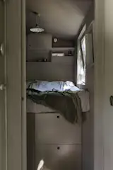 A pocket door provides privacy to the main bedroom.
