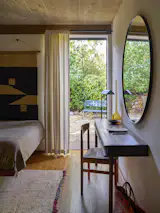 The new guest bedroom features a door that leads to the garden.
