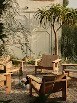 A firepit is surrounded by what the owners think is their biggest splurge: Kalon Rugosa chairs for $11,263.