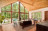 Living Room, Sofa, Light Hardwood Floor, Wood Burning Fireplace, and Ceiling Lighting  Photo 2 of 15 in Hudson Woods by Lang Architecture