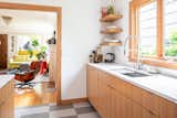 Kitchen, Engineered Quartz Counter, Wood Cabinet, Linoleum Floor, Undermount Sink, Recessed Lighting, and Ceramic Tile Backsplashe Kitchen  Photos from Ballard Residence